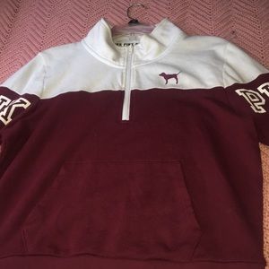 Pink zip up pull over jacket.